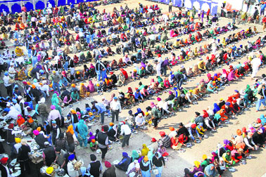 A large number of devotees partake of langar at a gurdwara on the occasion.