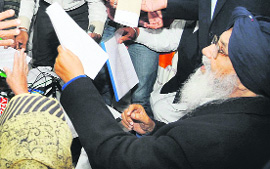 Chief Minister PS Badal listens to public grievances in Kapurthala on Sunday. 