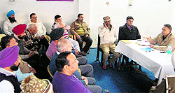 Parampal Singh (right), ADCP, City-1, along with other police officials holds a nukkad meeting regarding beat-patrolling system with residents of the Shivala Mandir area in Amritsar on Monday