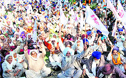 Farmer organisations protest outside the office of PSPCL Chief Engineer (Border Zone) in support of their demands in Amritsar on Monday