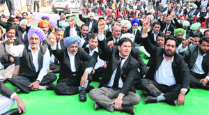 Lawyers ptotest outside the SSP office in Bathinda on Monday. 