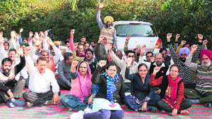 Members of the Joint Action Committee of the BDA raise slogans against the government in Bathinda on Monday. 