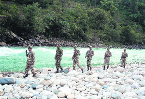 SSB jawans patrol along Kali river on the Indo-Nepal border in Pithoragarh district. 
