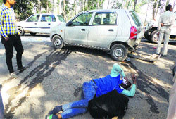 An accident victim lies on the roadside at Rookree village in Ambala on Monday. Tribune photo