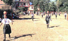 Students participate in a matka race in the school on Monday. Photo: Ashok Raina
