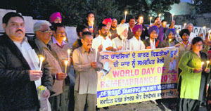 A candlelight march being taken out on the eve of World Remembrance Day at Aditya Jaitly Chowk in Model Town, Ludhiana, on Monday.