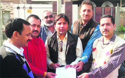 A Municipal Corporation team at a property tax awareness camp at Majitha Road in Amritsar. A Tribune Photograph 