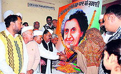 Workers of the Congress Bathinda (Urban) unit offer floral tributes to former Prime Minister Indira Gandhi on her birth anniversary, in Bathinda on Tuesday