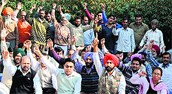 Members of the PUDA Mulazim Talmel Committee raise slogans against the state government in Bathinda on Tuesday