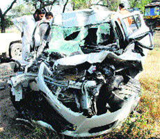 The mangled remains of a car that rammed into a tractor-trailer near Nejia village in Sirsa on Monday night. 
