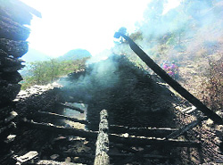 The charred remains of the shed at Nablai village in Mandi on Tuesday. 