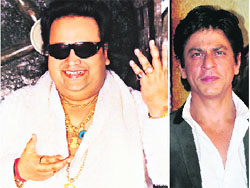 In contrast: (L-R) Bappi Lahiri and Shah Rukh Khan 