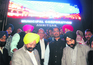 Anil Joshi, Local Bodies Minister, Inderbeer Singh Bolaria, CPS, Bakshi Ram Arora, Mayor, DPS Kharbanda, MC Commissioner, innaugrate the LED screen outside the Golden Temple in Amritsar on Wednesday. 