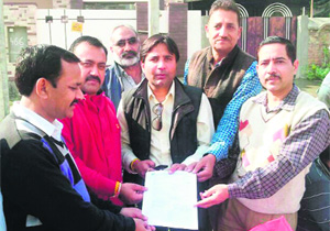 A Municipal Corporation team at a property tax awareness camp at the Majitha road in Amritsar.