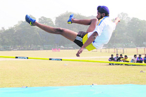 A student participates in the inter-college athletics meet at GNDU, Amritsar on Wednesday.