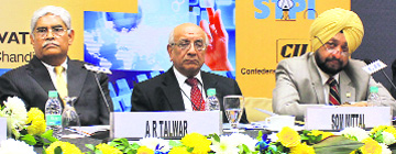 Nasscom president Som Mittal (C) shares the dais with other delegates at the CII, Sector 31, in Chandigarh on Wednesday. 