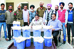 Counter Intelligence IG Jitender Jain with the seized opium in Bathinda on Wednesday