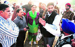 Damanjeet Singh Mann, SDM, talking to people about upgrading of Government Elementary School at Dhobians Basti in Bathinda on Wednesday