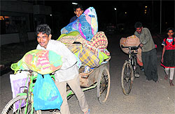 Residents shift their belongings to Dhanas Colony (EWS) in Chandigarh on Wednesday