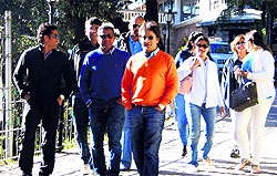 Sachin Tendulkar (extreme left) and Sameer Dighe come out of Rockeby Hotel in Mussoorie on Wednesday