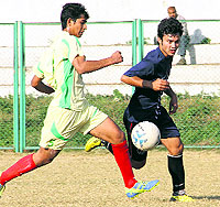 Players in action in a match in the Dehradun District Football Super League played at Pavillion Ground in Dehradun on Wednesday