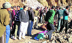 Villagers and cops at the accident site near Dharchula on Wednesday