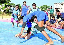 Girls in action in a kabaddi match in the 4th women state-level sports meet held at the PRD ground in Dehradun on Wednesday