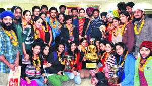Students of Apeejay College of Fine Arts, Jalandhar the overall trophy of win the overall trophy North Zone Inter University Youth Festival in Lucknow. Tribune photo: Malkiat Singh