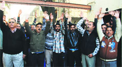 Members of the Provincial Power Employees Union stage a protest in Jammu on Wednesday. Tribune photo: Anand Sharma