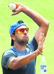 Yuvraj Singh bowls during a practice session on the eve of the 1st ODI against West Indies at Jawaharlal Nehru Stadium in Kochi on Wednesday. 