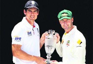 Alastair Cook and Michael Clarke pose with the Ashes Trophy on the eve of the first Test in Brisbane on Wednesday. 