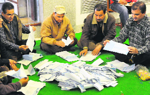 Electoral commision workers count votes at the commision's office in Kathmandu on Wednesday. 