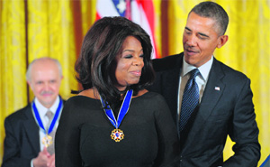 US President Barack Obama presents the Presidential Medal of Freedom to broadcast journallist Oprah Winfrey in Washington DC on Wednesday.