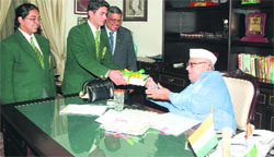 Captains of Wynberg Allen Schools present a history book written by Rakshananad Jalil about the school on its 125 years to Governor Aziz Qureshi in Dehradun on Wednesday. A Tribune photograph