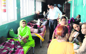 An overcrowded Palampur hospital where patients are accommodated in corridors. 