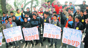 ABVP activists raise slogans outside the Deputy Commissioner office in Shimla on Thursday.