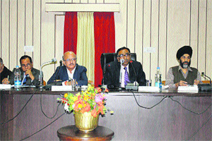 SC Sinha, an NHRC member, speaks at a workshop in Chamba on Wednesday.