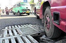 A manhole with a broken lid poses danger to commuters in Jammu