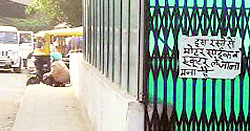 A placard prohibits the use of the pedestrian underpass by motorcyclists in Ludhiana on Thursday