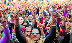 Aanganwadi workers protest outside the residence of Information and Broadcasting Minister Manish Tewari in Ludhiana on Thursday