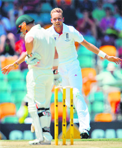 England's paceman Stuart Broad celebrates the wicket of Australia's David Warner during Day One of the first Ashes Test match in Brisbane on Thursday.