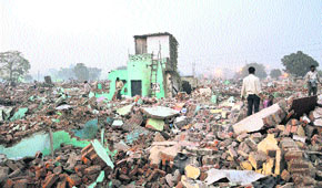 Amidst razed structures in Colony No. 5, one structure was not demolished due to stay from the High Court.