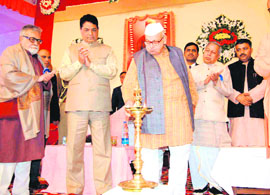 Governor Aziz Qureshi lights the lamp at the inaugural function of the 150th birth anniversary celebrations of Swami Vivekananda at Kankhal in Haridwar on Friday.