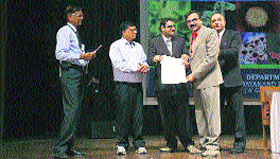 Dr Kashyap Kumar Dubey of MDU being presented the Young Scientist Award of the Association of Microbiologists of India during the 54th annual conference of the association held at Rohtak.