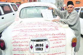 Slogans written on Sultan Walis Ambassador in Srinagar.