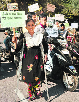 Physically challenged persons take part in a voter awareness rally in Bikaner on Friday. 