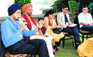 (From left) Navtej Sarna speaks at the lit fest, "Literati-2013", at the Lake Club, Chandigarh, on Saturday. Roopinder Singh, Madhu Kishwar, Kishalay Bhattacharjee and Rahul Pandita are also seen in the picture. 