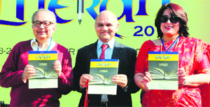 (From left) Bhaskar Ghose, KK Sharma, Adviser to the UT Administrator, and Sumita Misra release a souvenir at the inaugural function of the lit fest at the Lake Club, Chandigarh, on Saturday. 