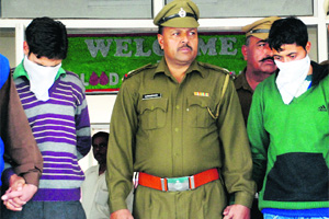 The accused in police custody.