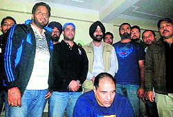 Jagdish Bhola (sitting) along with the Patiala police team in New Delhi on the day of arrest.